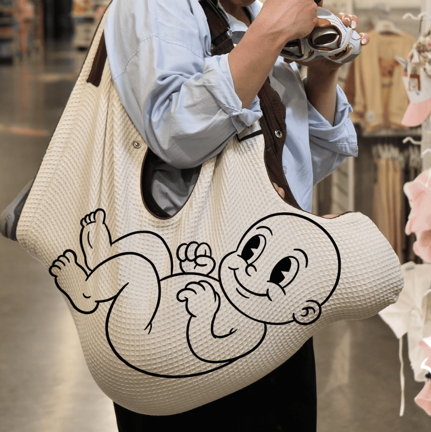 Illustration of an ergonomic baby carrier supporting the natural C-curve of a newborn's spine for healthy development.