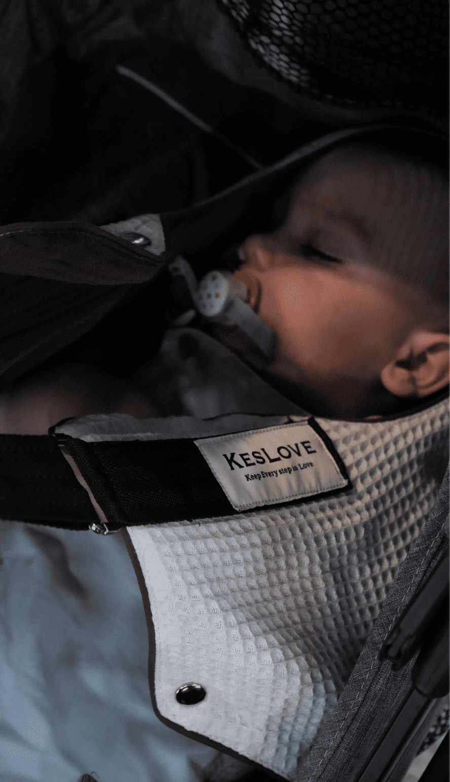 The KESLOVE baby carrier in a compact, folded state for easy travel and storage.