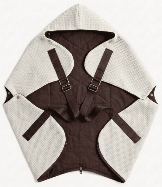 Ergonomic KESLOVE Ivory baby carrier made of natural waffle muslin fabric, top view.